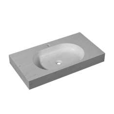 Owalna umywalka ścienna z kamienia naturalnego z wbudowanym blatem Porcelanosa Karon